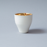 One Million - Kleiner Becher

Item 5384 - Edition Necha Zupnik - Kiddusch Becher – Judaica, September 2020
Porzellan, transparent glasiert, 12 Karat Brandvergoldung innen / Höhe 8 cm / Durchmesser 7 cm 
mit Gravur: Stempel Shadai & Davidstern

